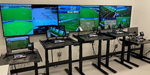 The Miami Dolphins' video control room, an 8K Solutions SmartField product. Features standing desks with hi-def video screens and video editing keyboard.