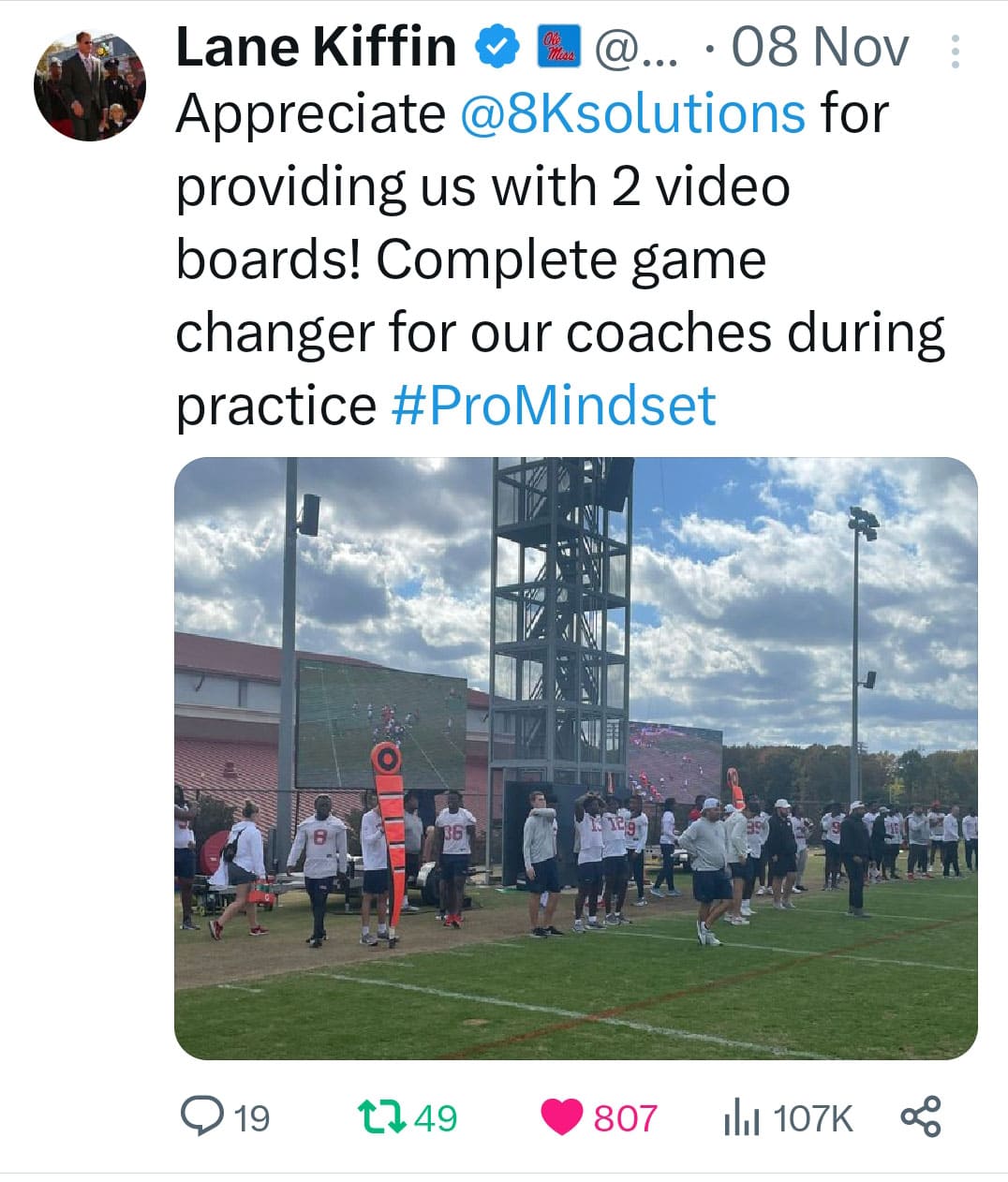 Screen capture of a post of X by Ole Miss Football Coach Lane Kiffin that read," @Appreciate @8Ksolutions for providing us with 2 video boards! Complete game changer for our coaches during practice #ProMindset". This picture shows two Lyvve Coach boards set up at a team practice.