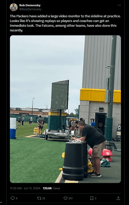 A mobile instant replay board, called Lyvve Coach, is seen at the edge of a football practice field at the Green Bay Packers complex on June 11, 2024.