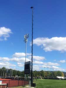 A fully raised mast of an in-ground pneumatic mast with a single camera.